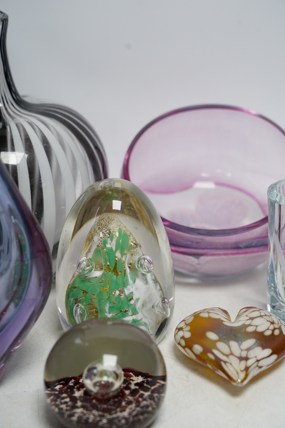 A group of ornamental coloured glass vases and paperweights including Murano, largest 22cm high (8). Condition - good